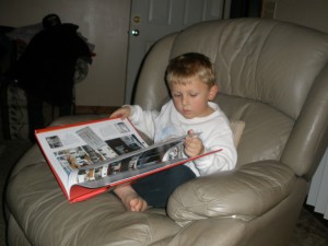 caught in the act of reading, kathleen ellison, kevin reading about boats, http://PragmaticMom.com, PragmaticMom
