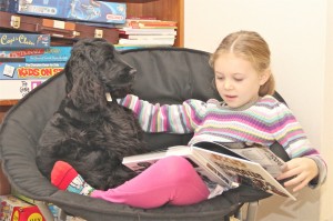 Caught in the act of reading issie reading with her dog pragmatic mom