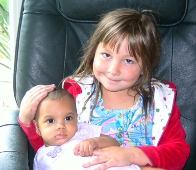 child holding baby babycarebasics.net pragmaticmom.com