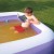 boy reading in pool