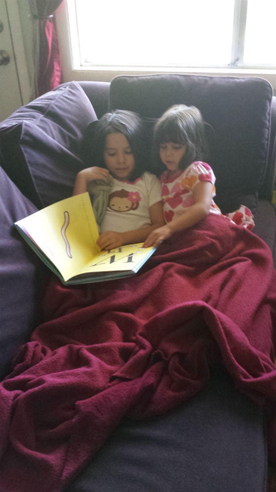 sisters reading together