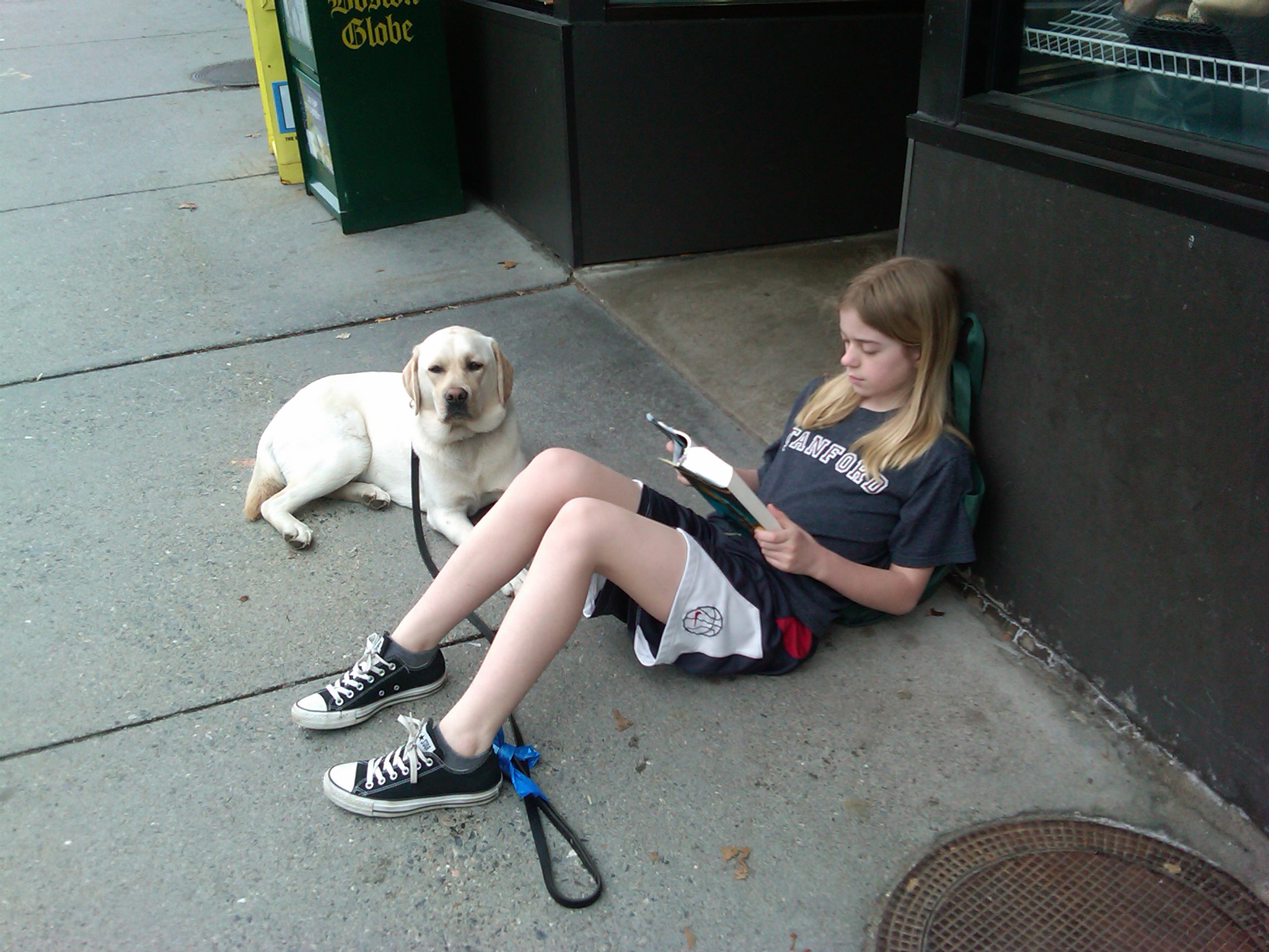 girl reading with dog golden labrador author Karen L Day caught in the act of reading Pragmatic Mom
